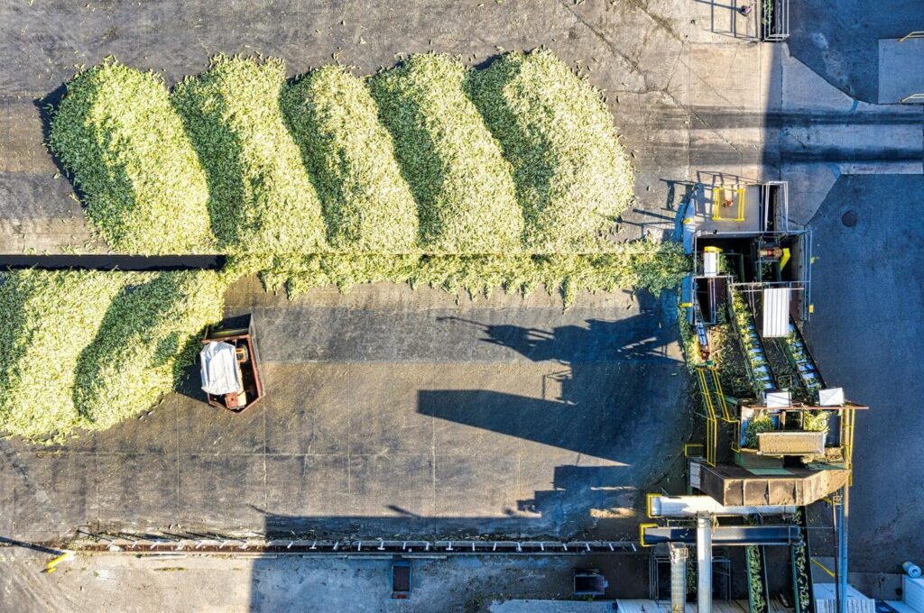 Aerial view of industrial corn processing with machinery in Plainview, Minnesota.